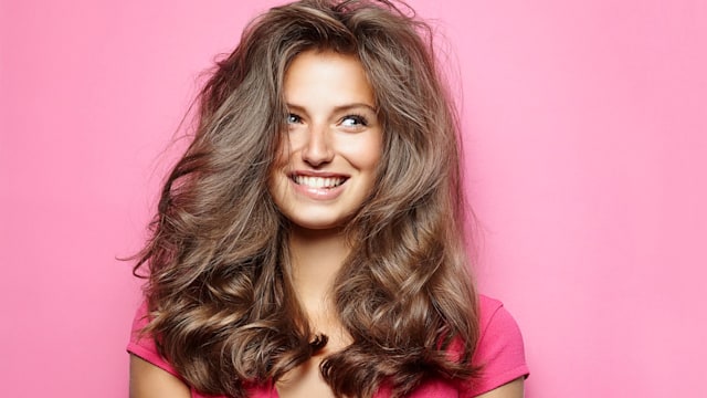 How to stop hair loss - woman with thick hair