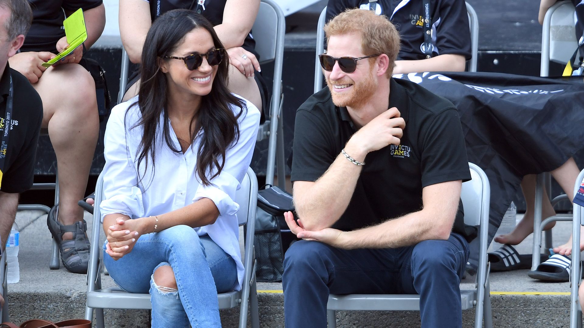Harry and Meghan smiling together at Invictus Games Toronto 2017