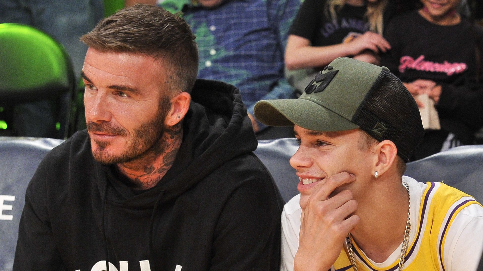 David Beckham and his son Romeo Beckham at basketball game