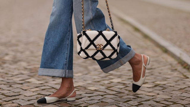 Jill Asemota wearing Chanel black and white bag