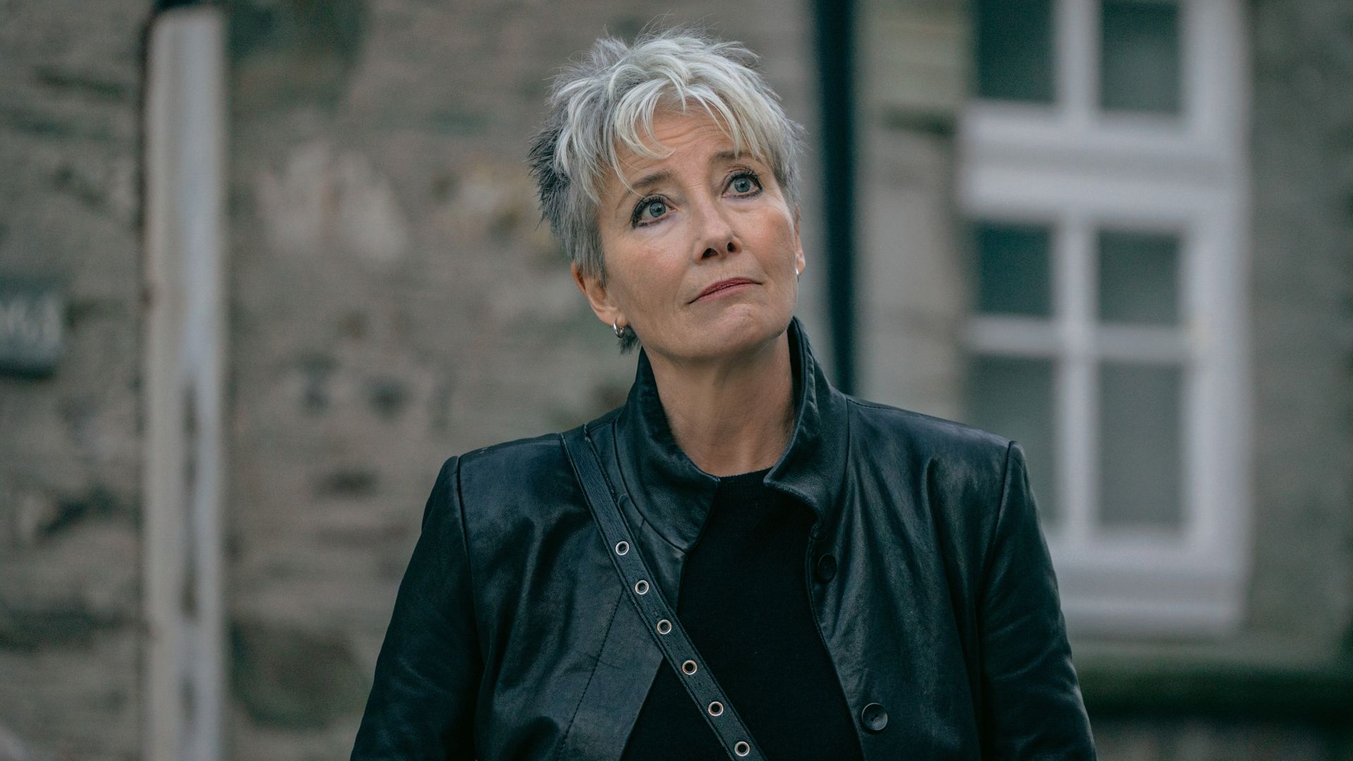 close up woman in black jacket outdoors