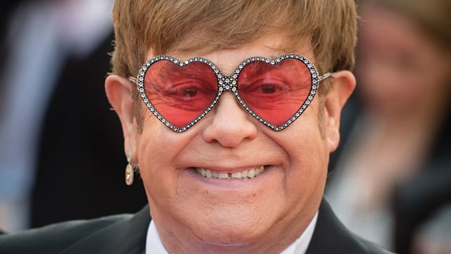 Elton John smiling heart sunglasses