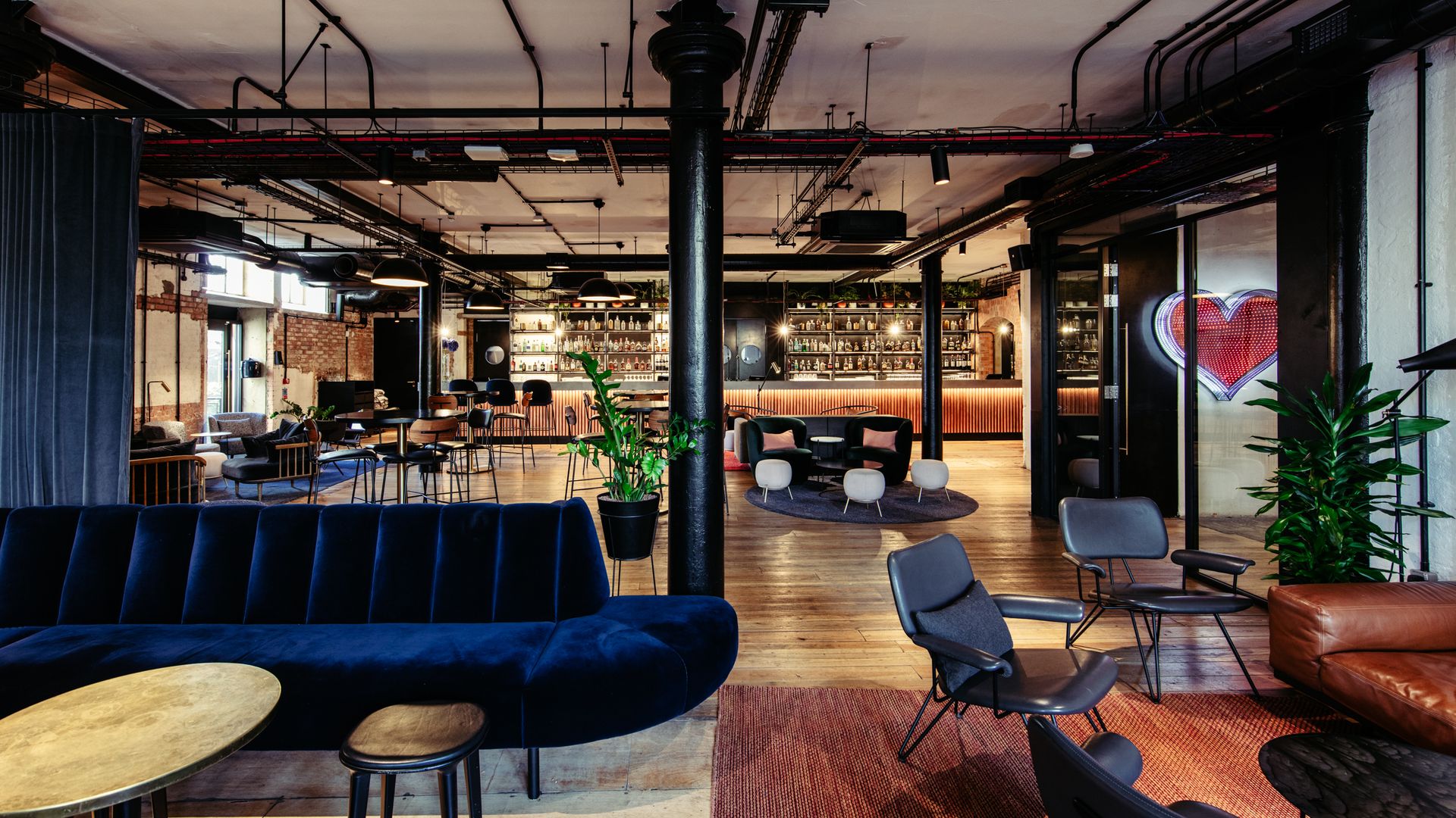 The Ministry bar decorated with arrangements of chairs and studio ceiling lights 