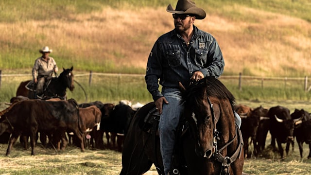 Cole Hauser sits astride a brown horse