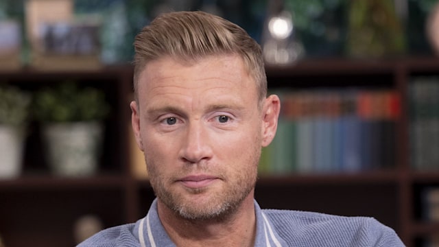 Freddie Flintoff in a blue shirt with his arms folded