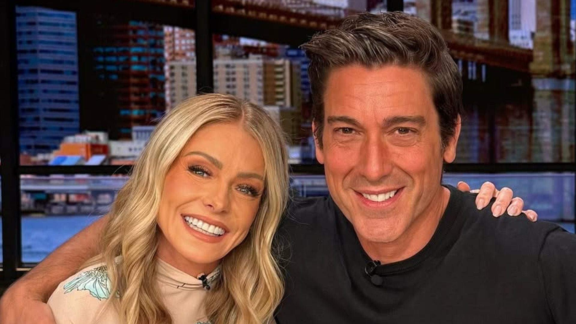 David Muir and Kelly Ripa pose for a photo on the set of LIVE with Kelly and Mark on Wednesday, July 30