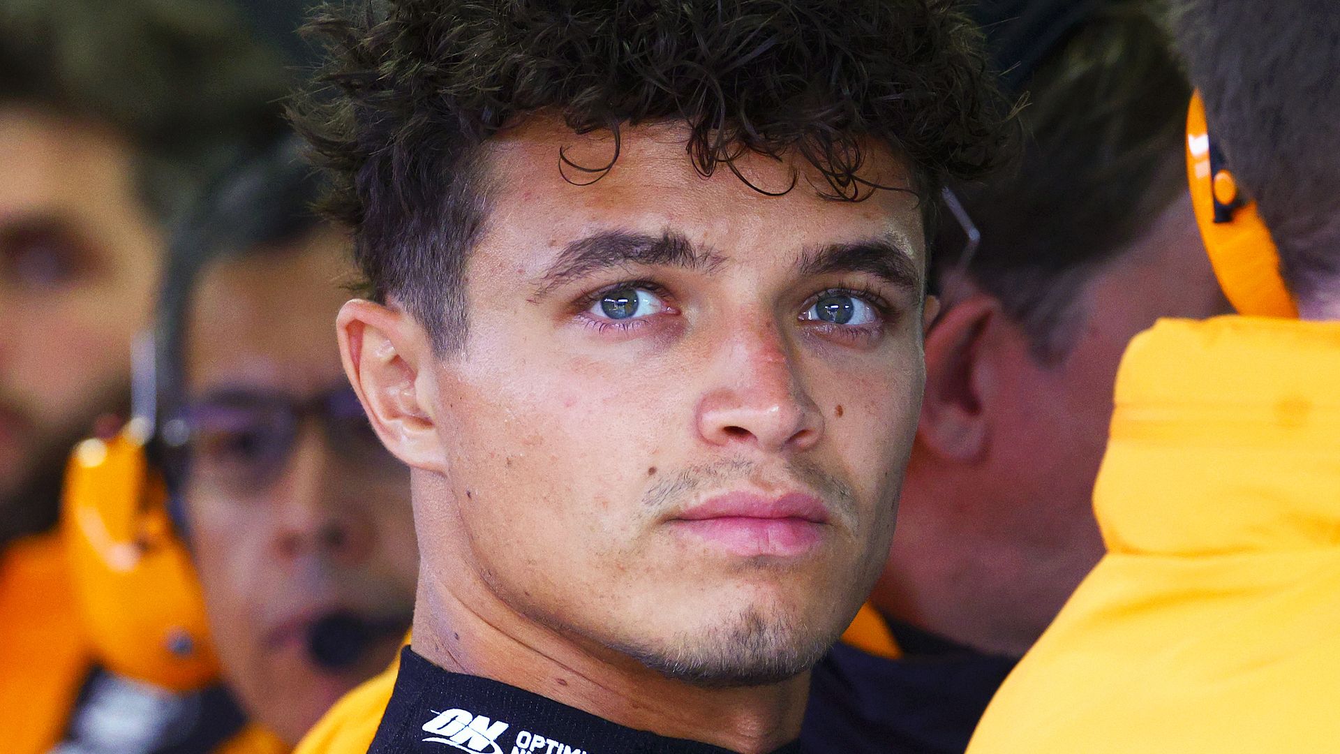 Lando Norris of Great Britain and McLaren looks on from the garage prior to practice ahead of the F1 Grand Prix of Netherlands at Circuit Zandvoort 