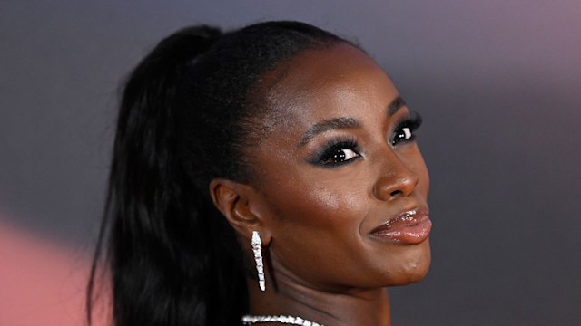 AJ Odudu smiling in black dress at Glamour Women of The Year Awards in 2023 