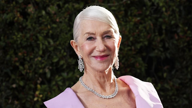 woman in purple dress smiling for camera