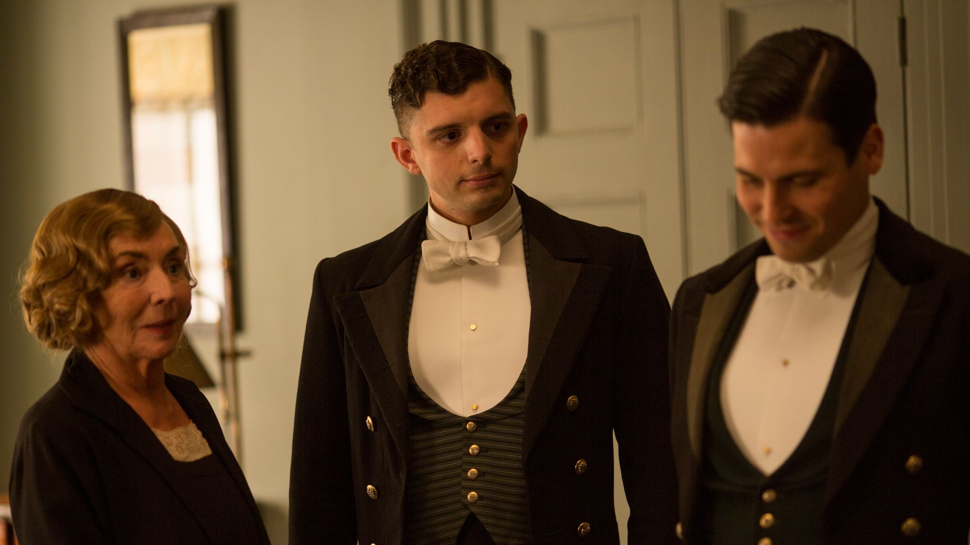 SUE JOHNSTON as Denker. MICHAEL FOX as Andy and ROBERT JAMES-COLLIER as Thomas in Downton Abbey

