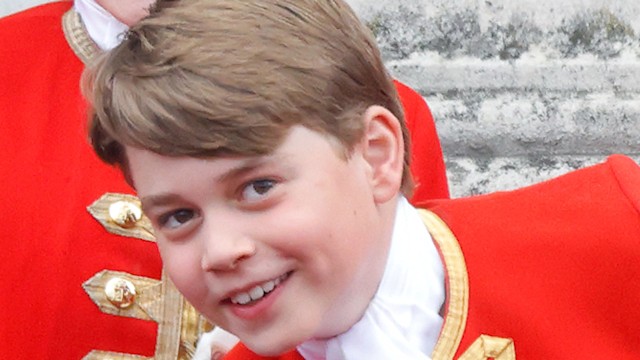 Prince George of Wales watches an RAF flypast from the balcony of Buckingham Palace following the Coronation of King Charles III & Queen Camilla in 2023