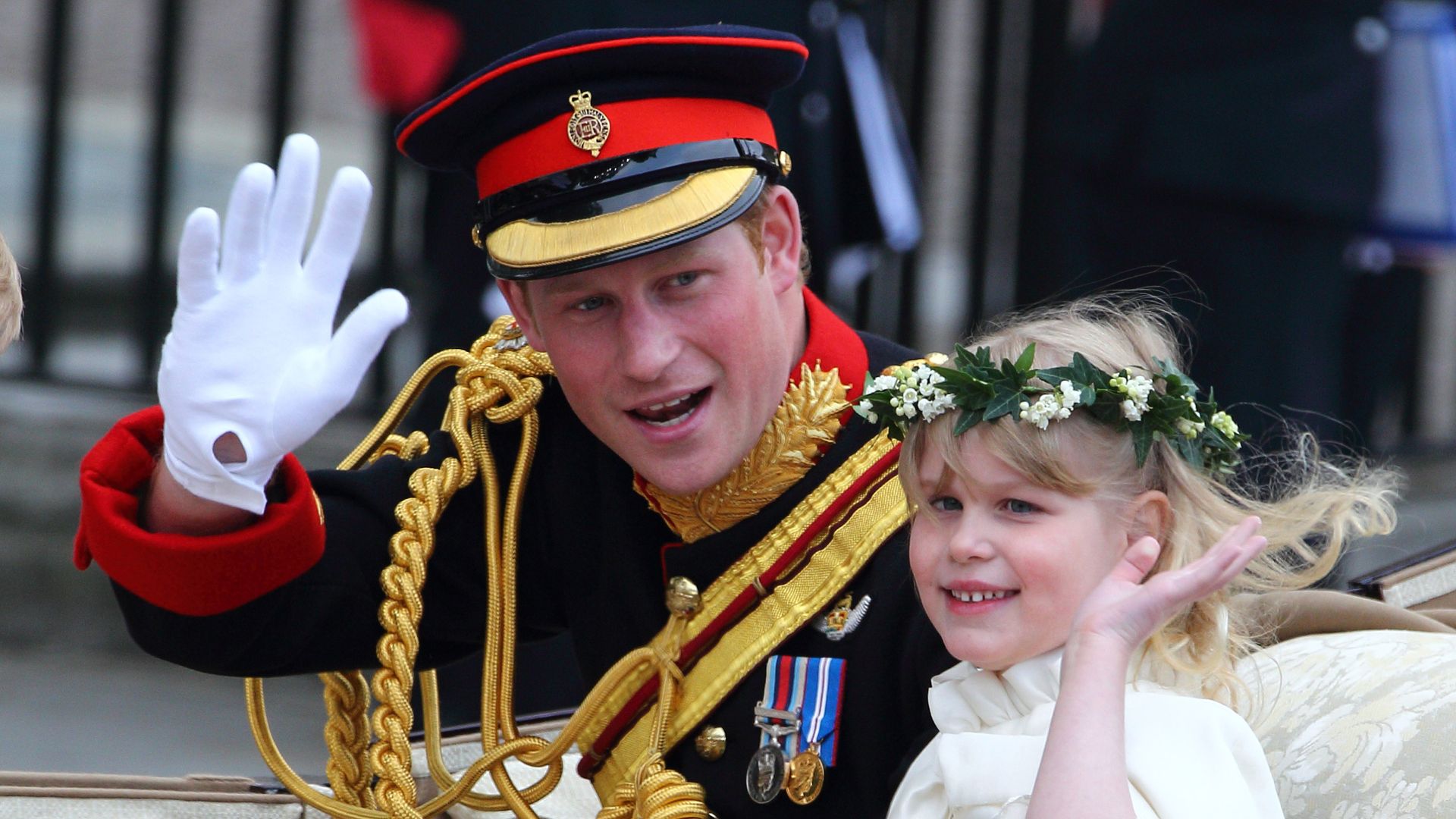 Lady Louise Windsor and Prince Harry waving following Prince William's wedding to Kate Middleton