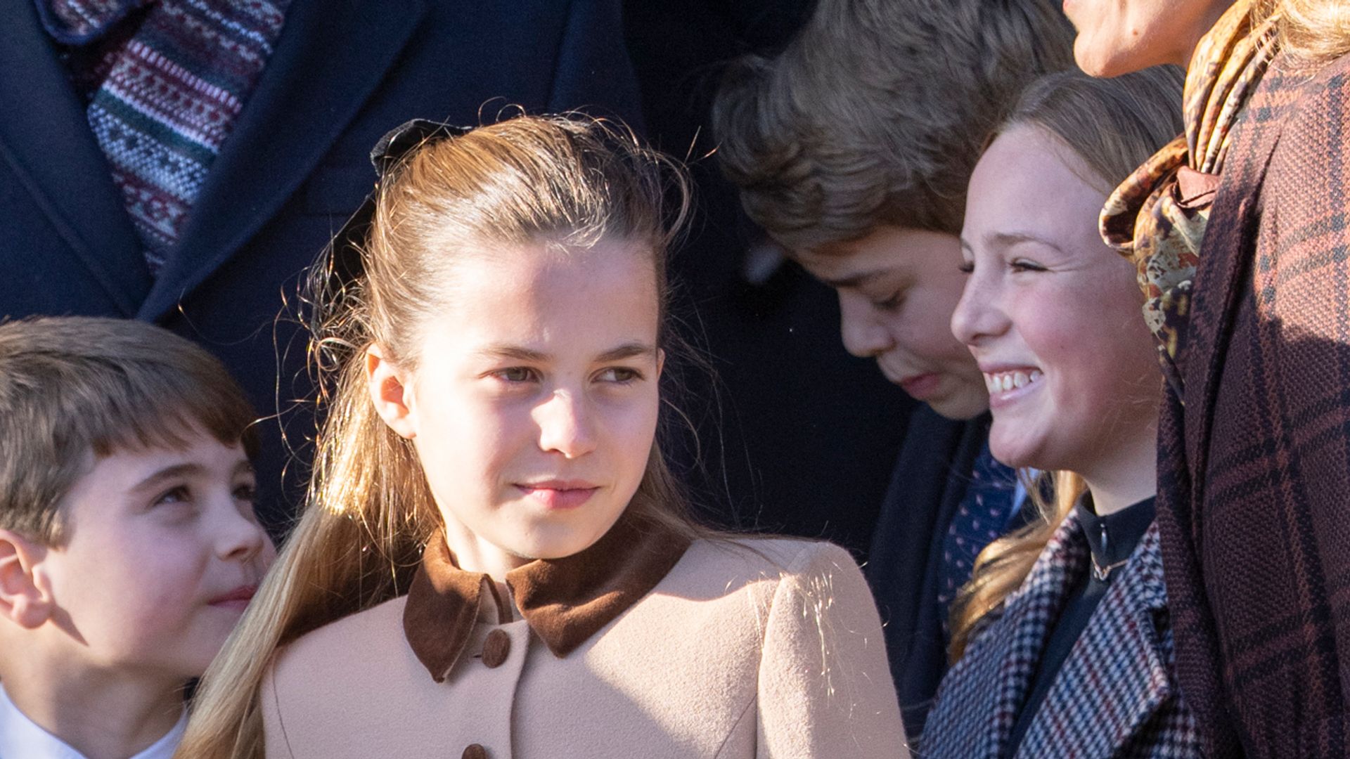 Watch the moment Princess Charlotte hailed as 'Princess Anne in the making' as she stops for Christmas Day selfie