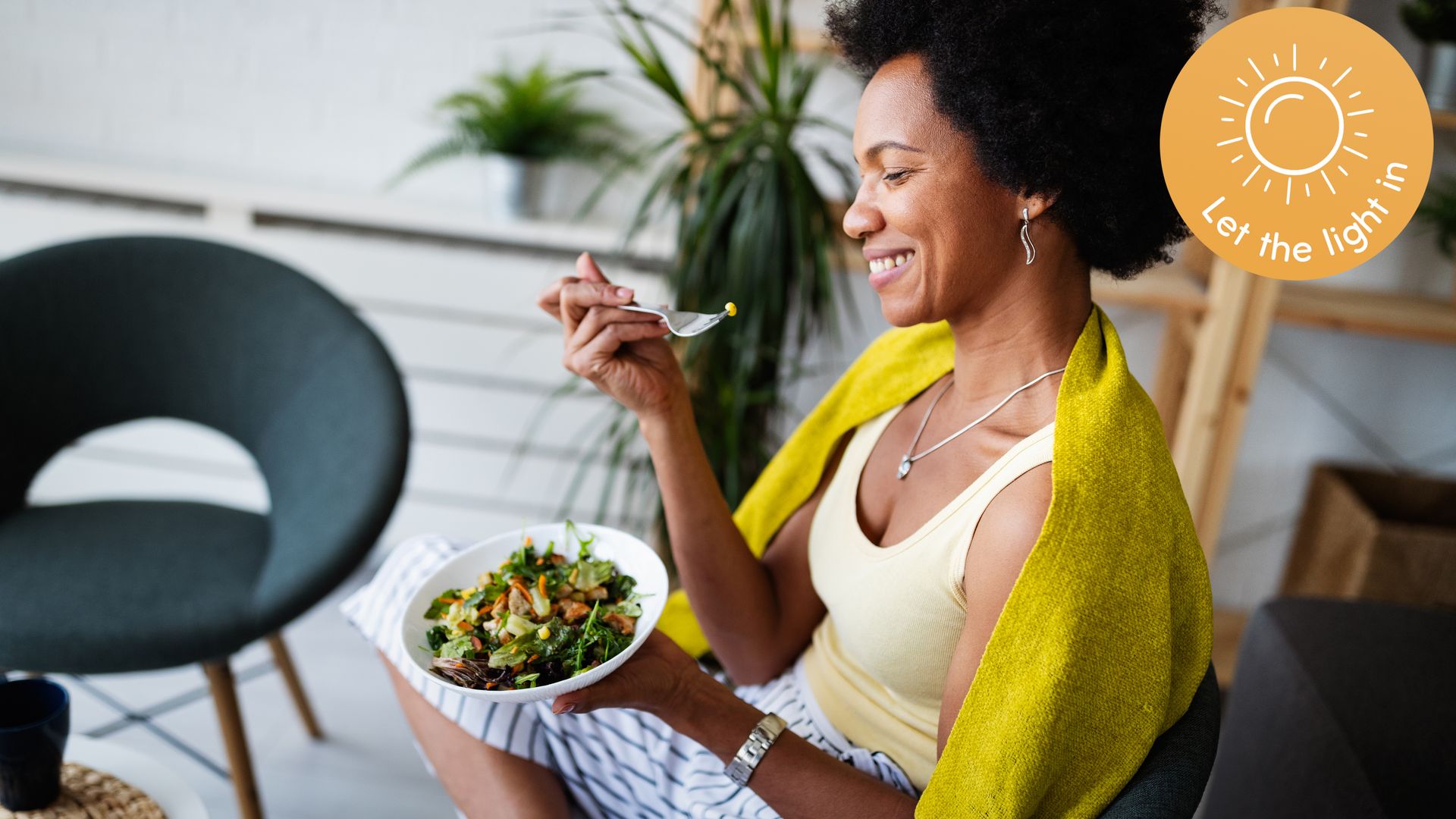 Woman smiling eating healthy food