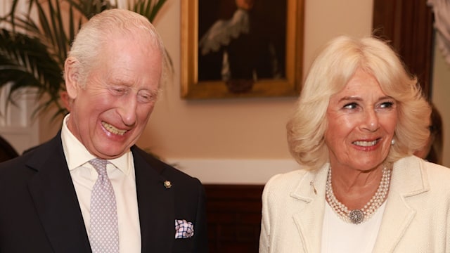 King Charles and Queen Camilla smiling