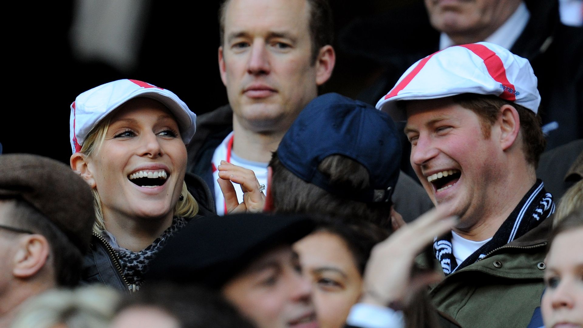 zara and harry watching rugby in matching hats 