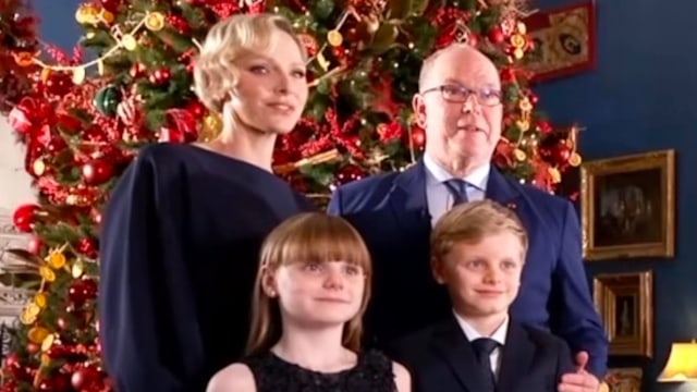 The Monaco Royal Family standing in front of a Christmas tree