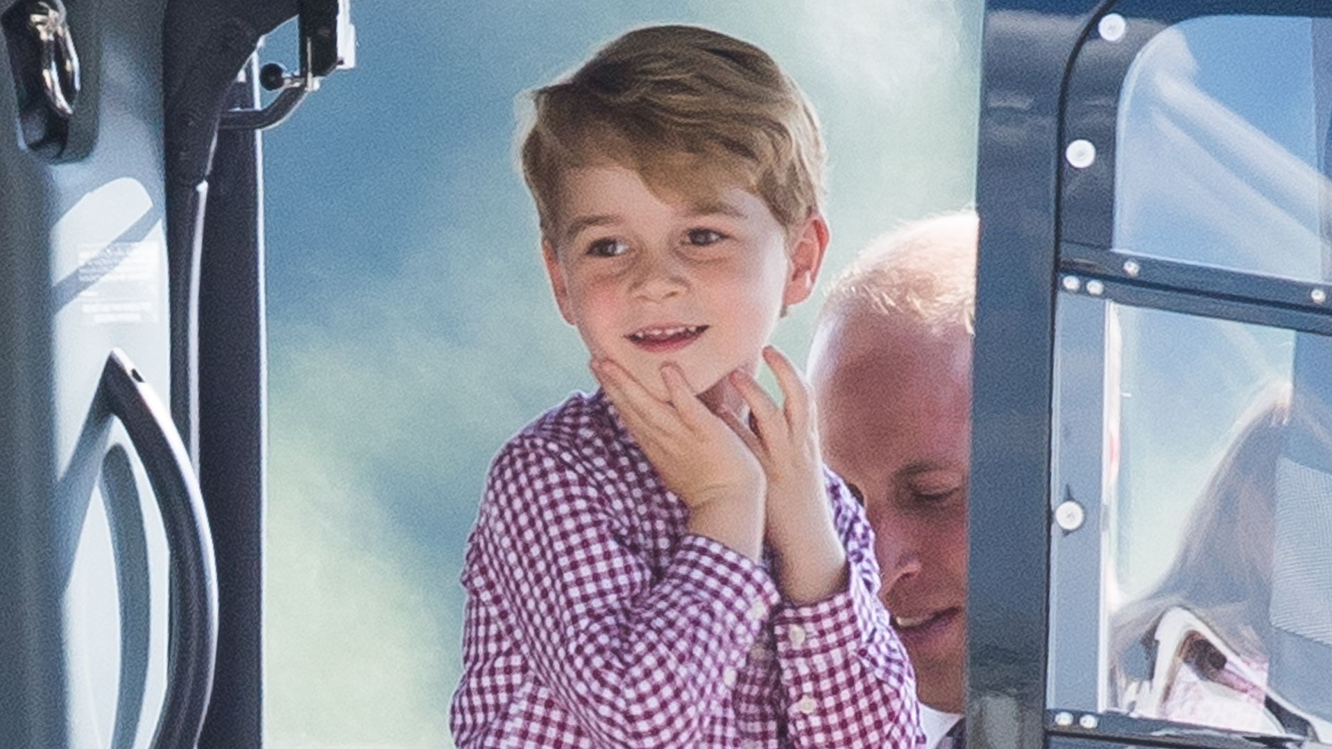 Prince George looking gleeful in a check shirt