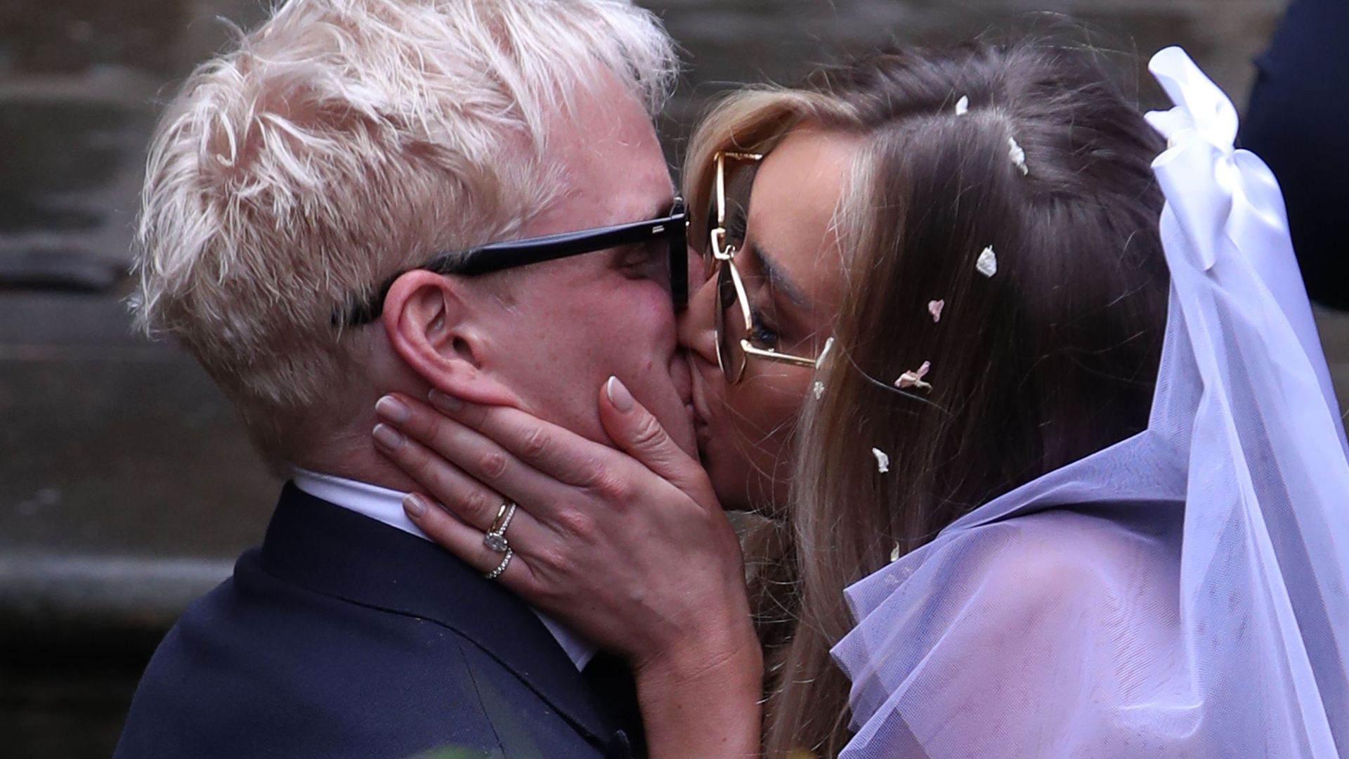 Jamie Laing and Sophie Habboo kiss at their Chelsea wedding