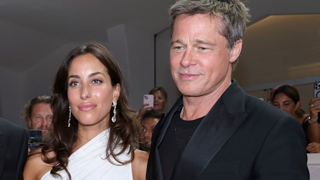 Ines de Ramon and Brad Pitt attend the "Wolfs" red carpet during the 81st Venice International Film Festival 