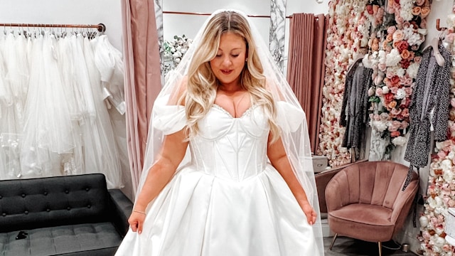 Woman in a white dress in a wedding dress shop