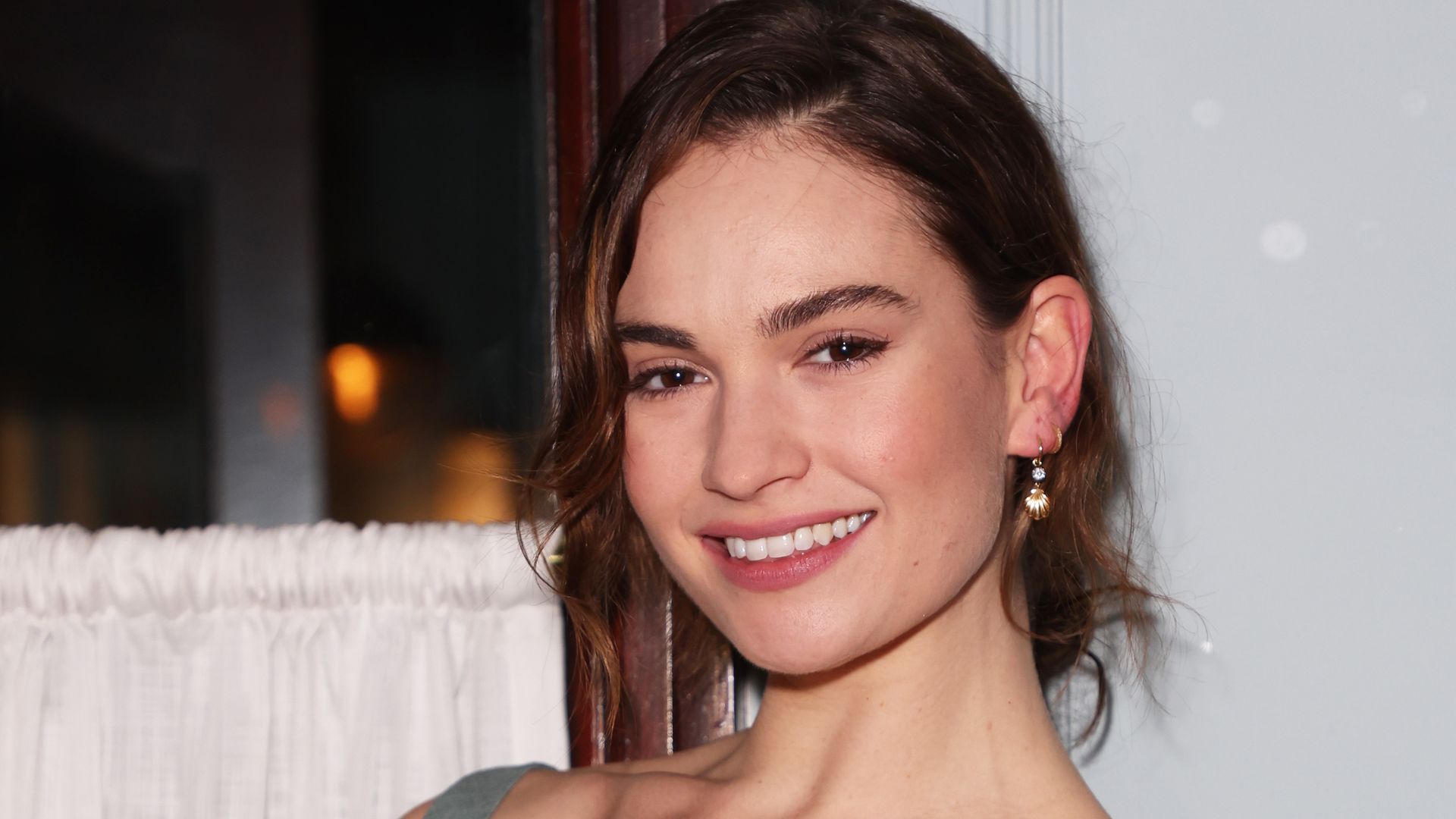 Lily James wear a grey scoop-neck gown to the afterparty of her recently released play Lyonesse