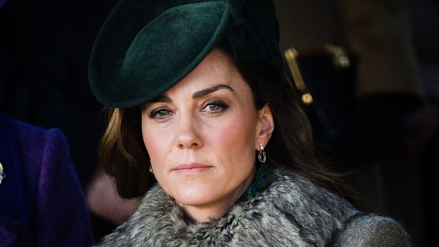 Kate Middleton wearing furry jacket and green hat