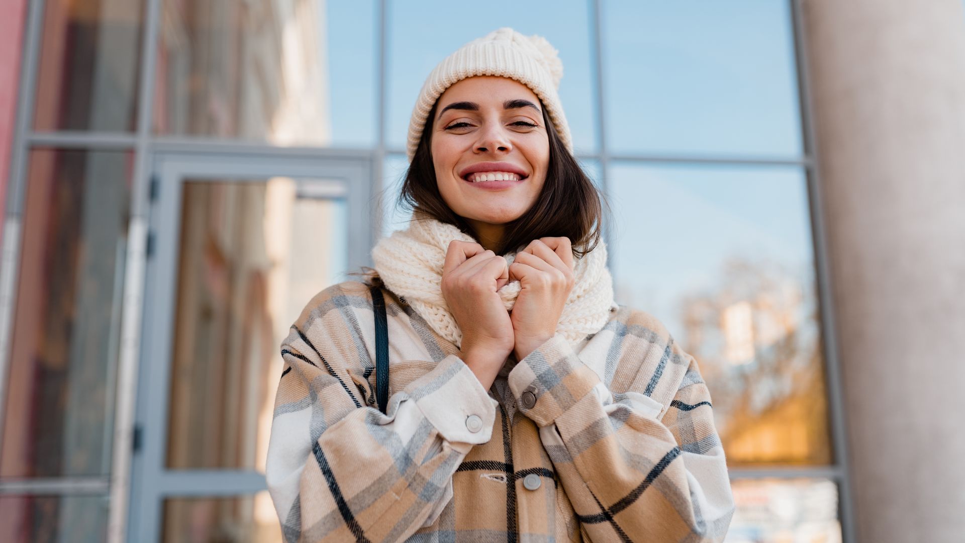 woman looking happy in her winter clothes