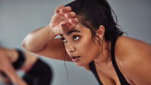 Shot of a young woman taking a break from her workout at the gym