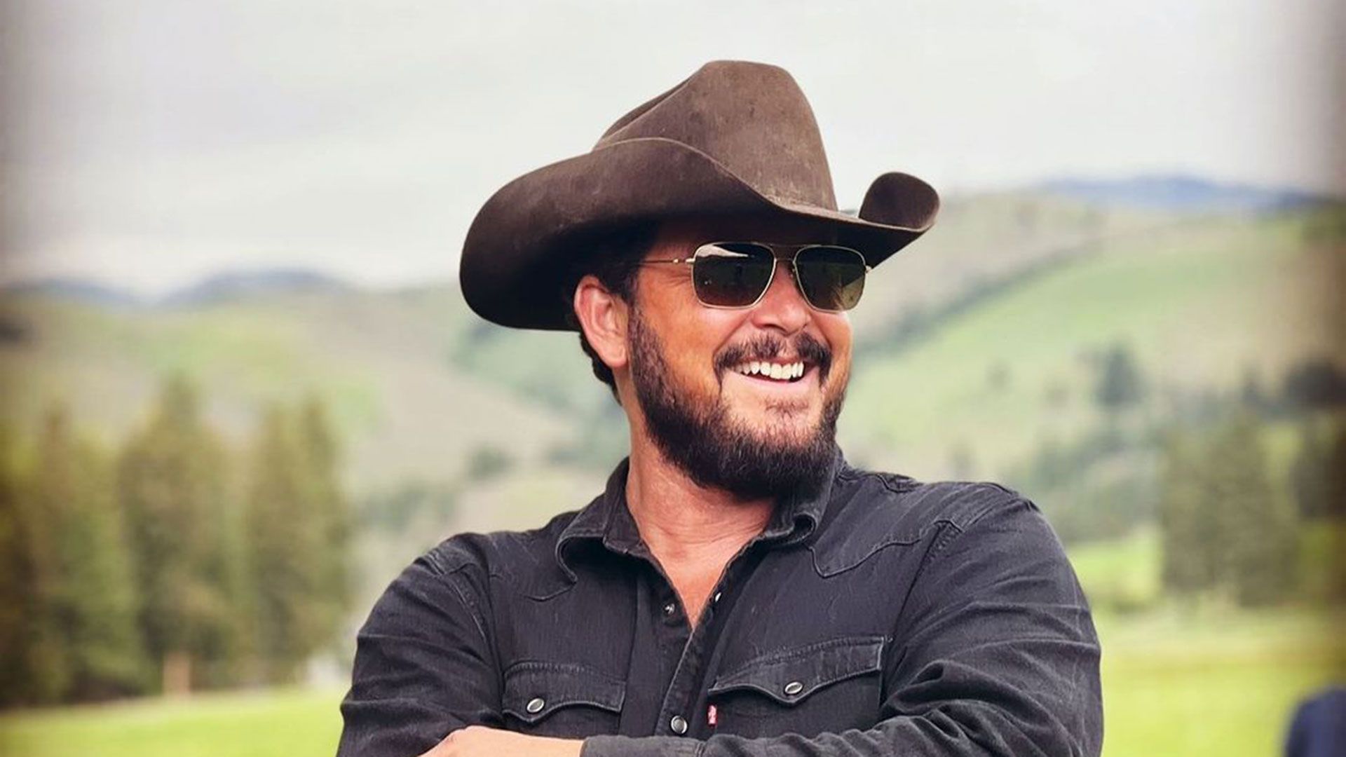 Cole Hauser smiling on the set of Yellowstone.