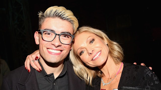 Michael Consuelos and Kelly Ripa pose backstage as Jake Shears of the rock group "The Scissor Sisters" makes his Broadway debut in the hit musical "Kinky Boots" on Broadway at  The Al Hirschfeld Theatre on January 8, 2018 in New York City