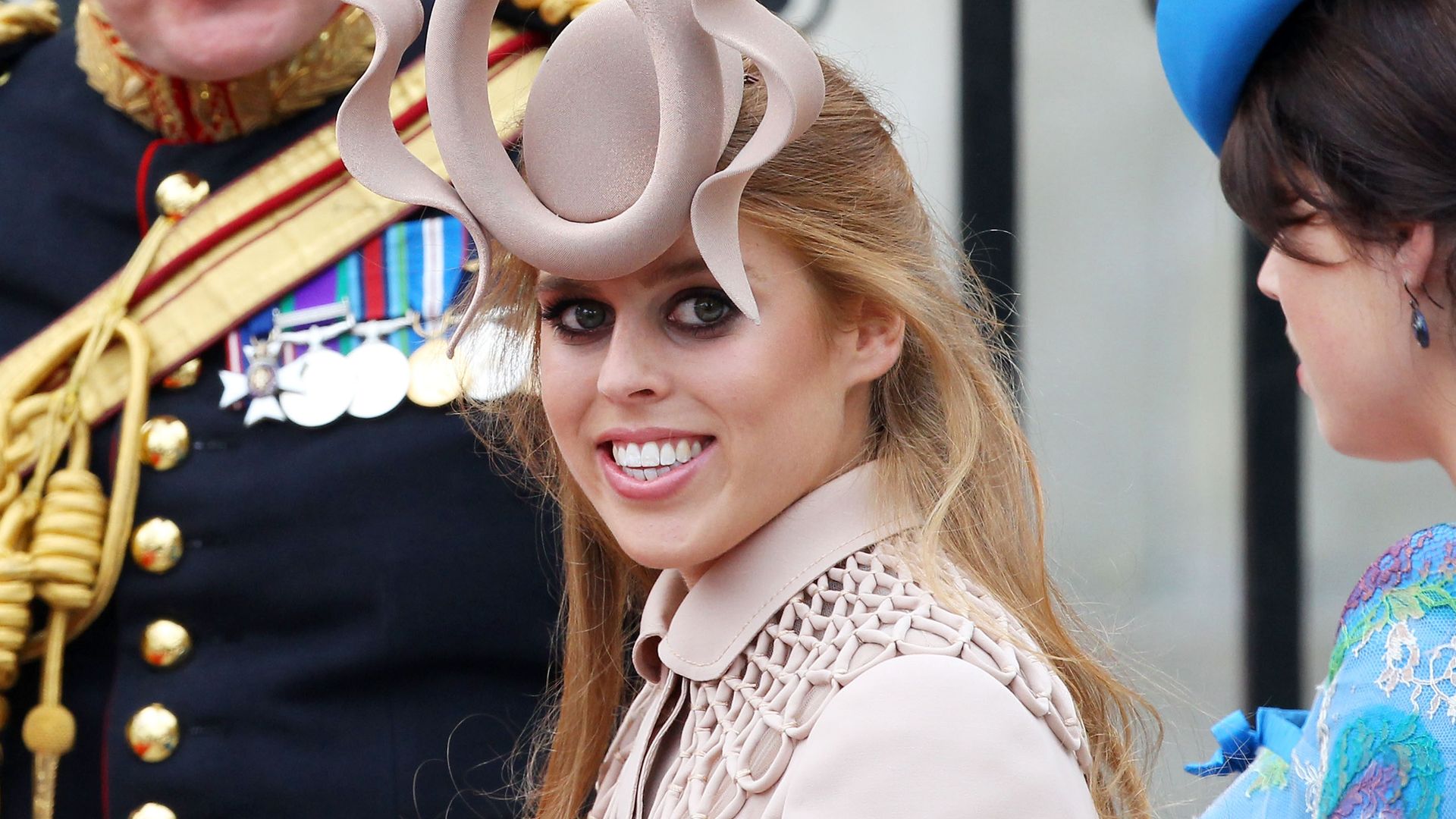 Princess Beatrice of York in a nude dress and fascinator at Prince William's royal wedding