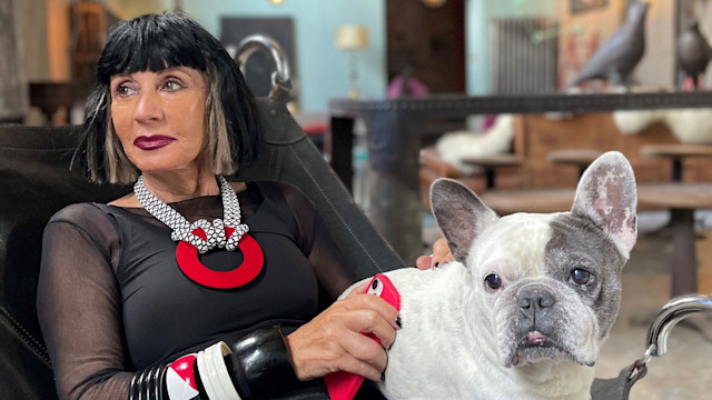 woman sitting with french bulldog