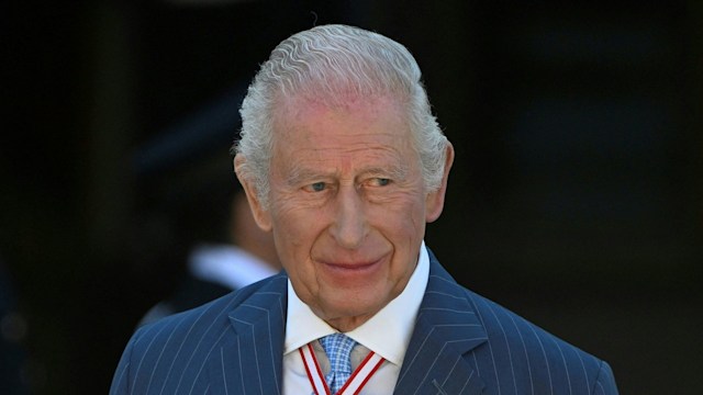 King Charles with medals and a medallion