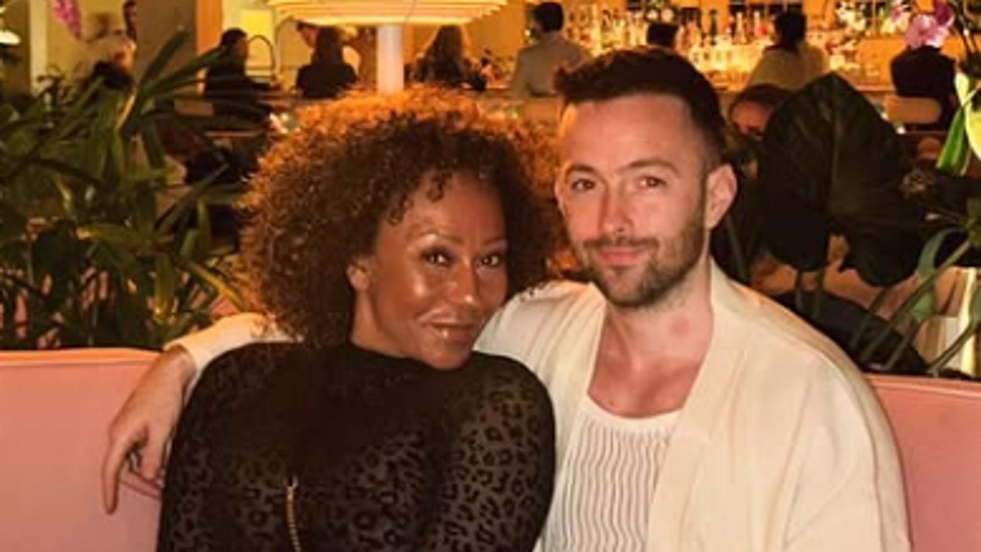 Mel B and Rory McPhee sitting in a restaurant