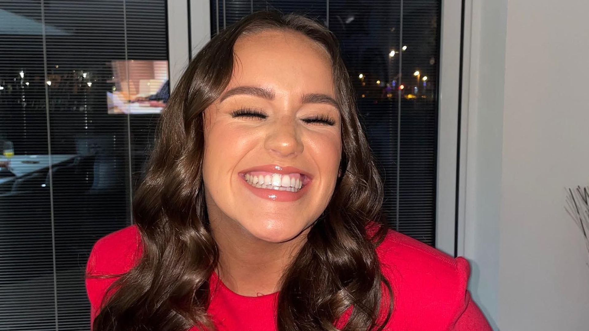 Strictly winner Ellie Leach wearing red dress with long curly hair