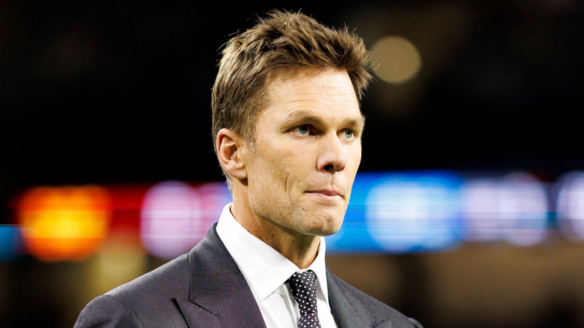 Fox Sports commentator Tom Brady stands on the field prior to the NFC Divisional Playoff game between the Washington Commanders and the Detroit Lions, at Ford Field on January 18, 2025 in Detroit, Michigan