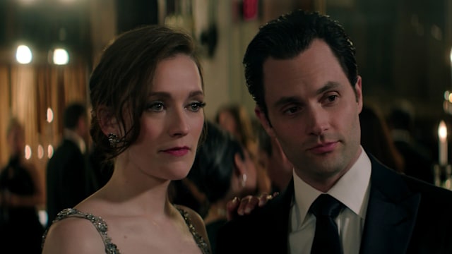 Man and women wearing black tie