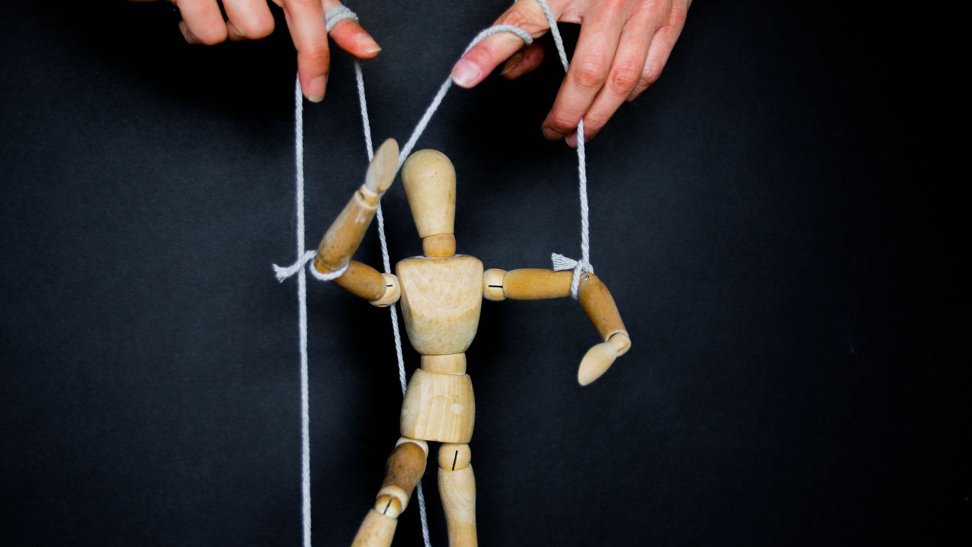 Marionette on a black background