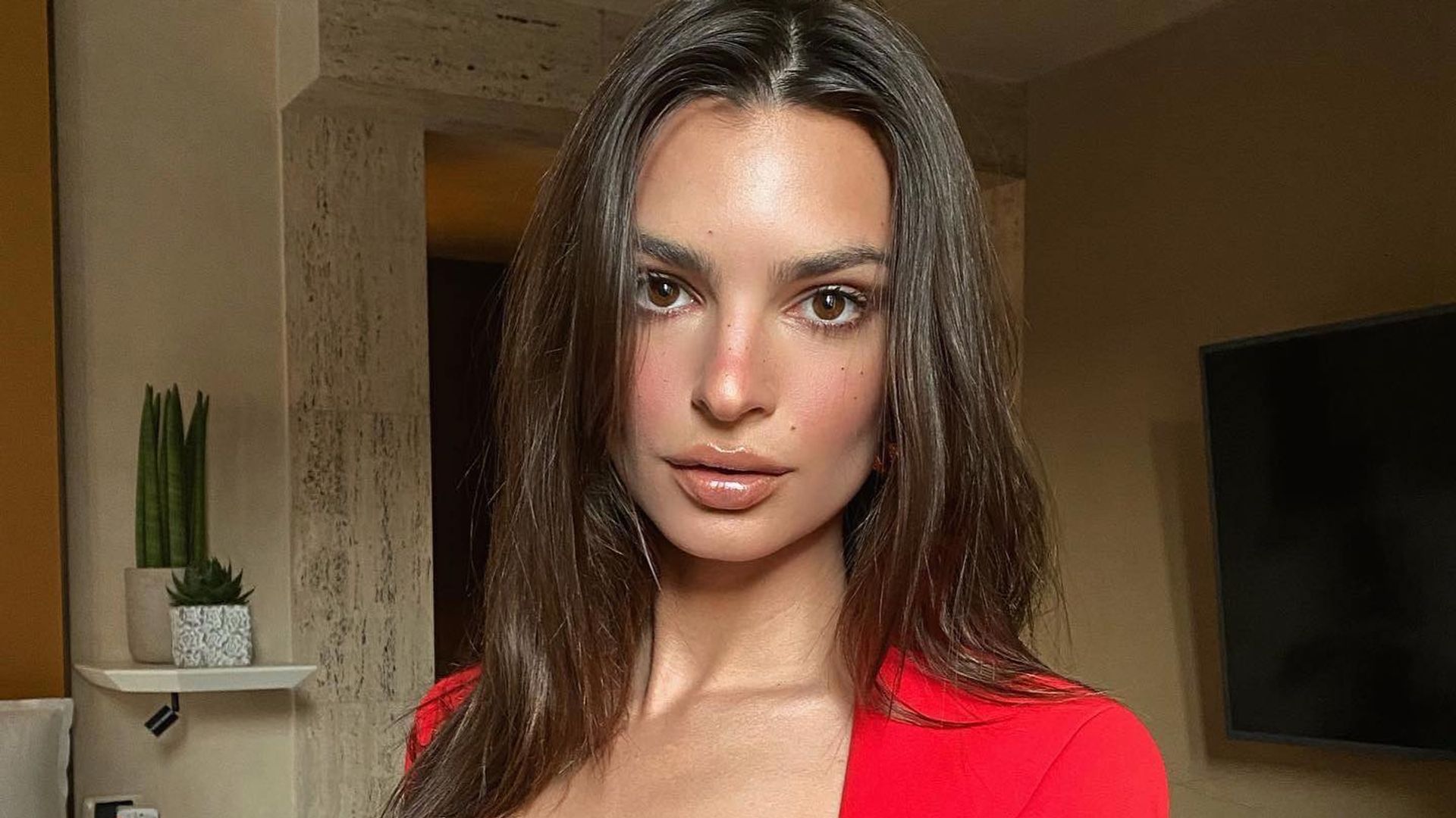 Emily Ratajkowski shows off her chiselled abs in risqué cut-out jumper