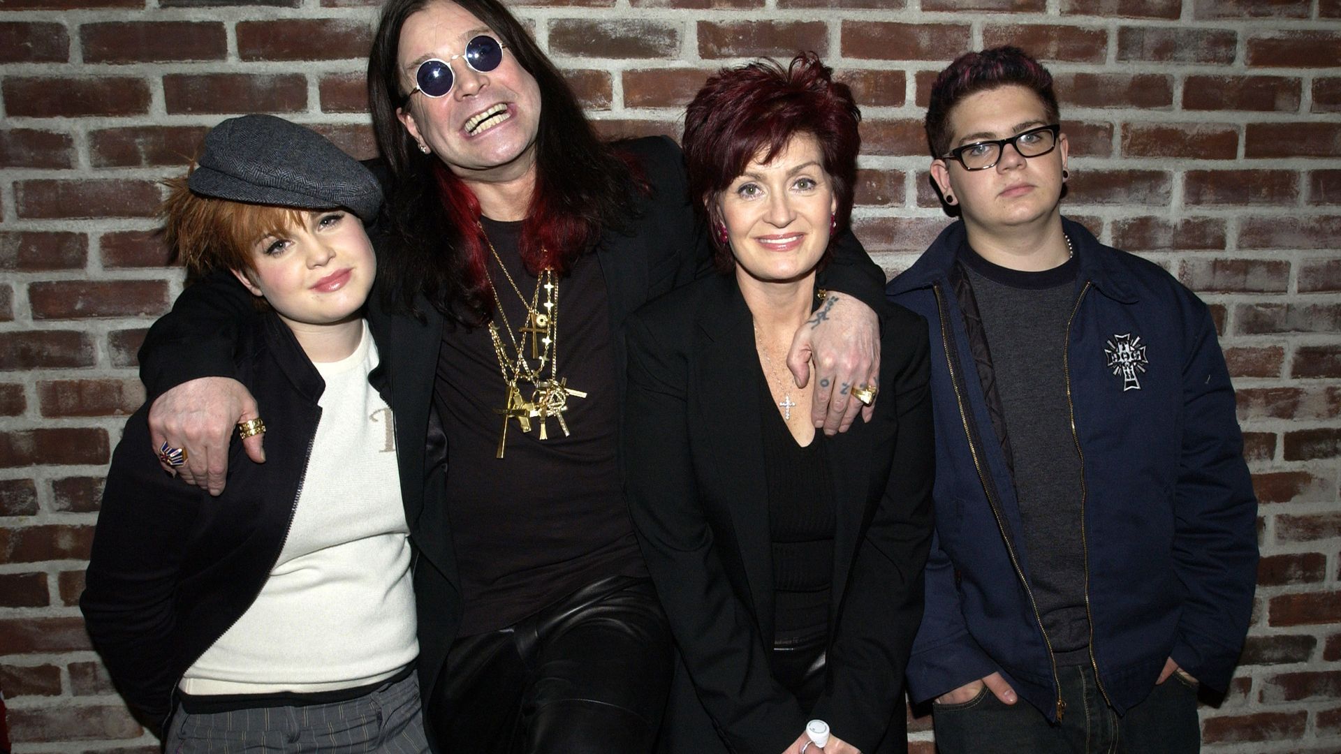 Kelly Osbourne, Ozzy Osbourne, Sharon Osbourne and Jack Osbourne standing together 