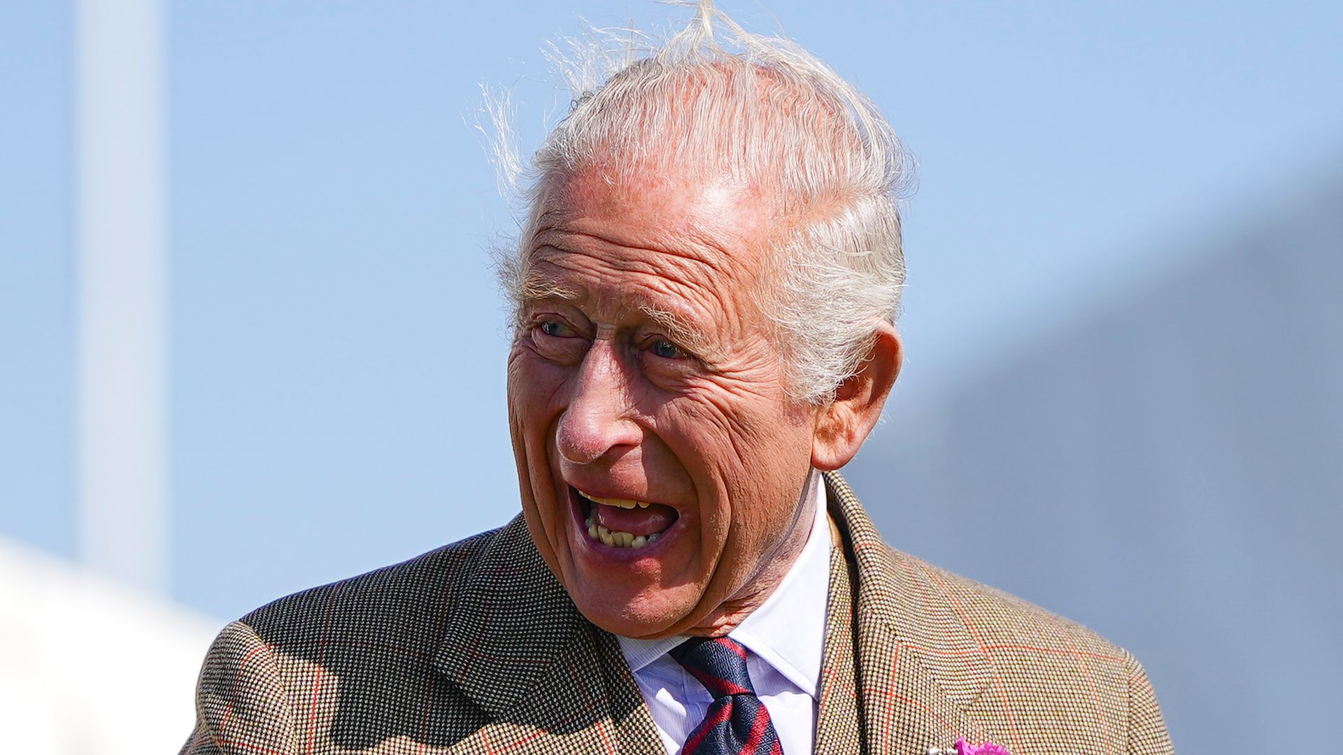 King Charles laughing