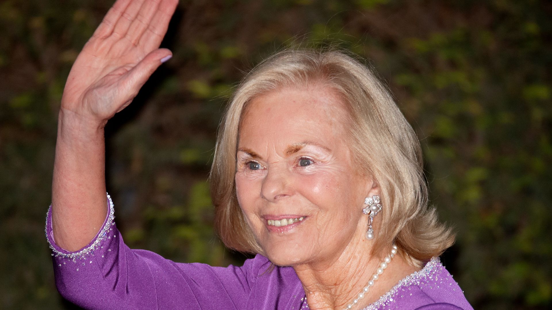 Katharine, Duchess of Kent waving in purple dress