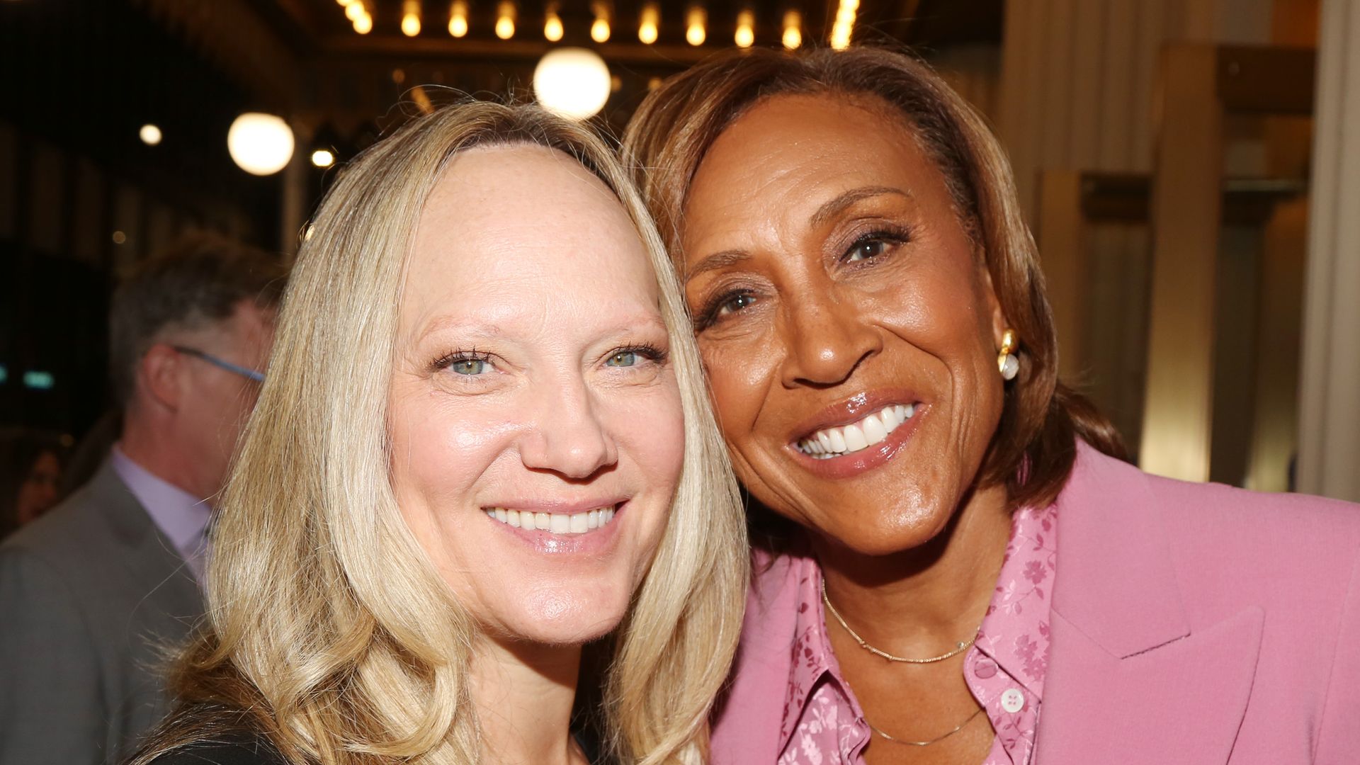 Amber Laign and wife Robin Roberts pose at the opening night of the new play "Left on Tenth" on Broadway at The James Earl Jones Theater on October 23, 2024 in New York City