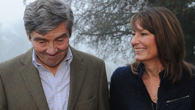 Carole Middleton laughing and looking at Michael who pulls a face