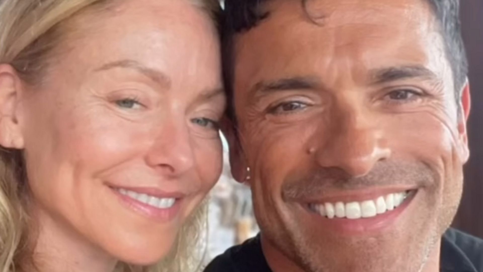 Clip of a video montage shared by Kelly Ripa shared on Instagram September 2023 where she is posing next to her husband Mark Consuelos during their beach vacation with their kids.