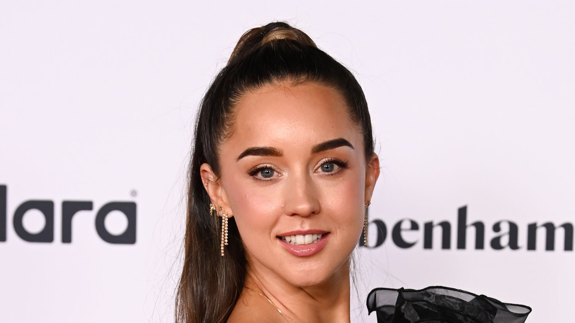 emily andre in black ruffle dress