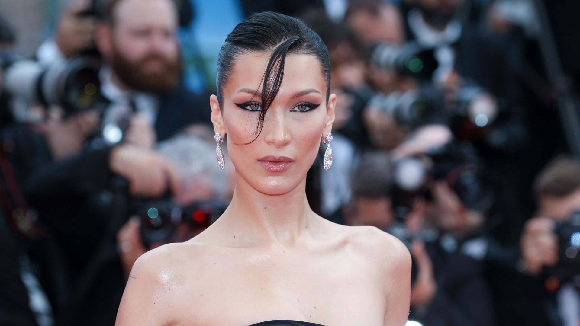 Bella Hadid in a black strapless dress on the red carpet 