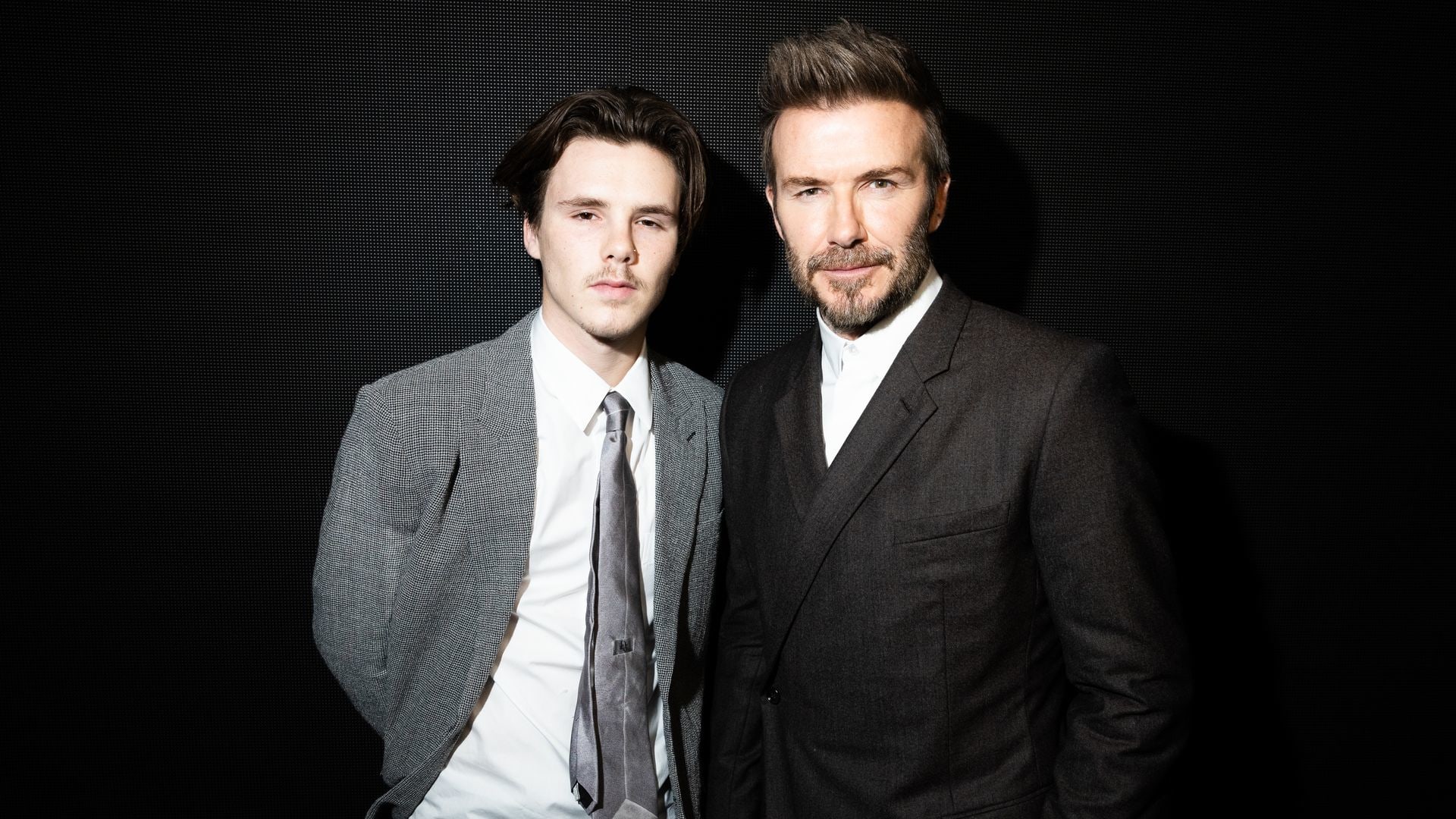 For Non-Editorial use please seek approval from Fashion House) Cruz Beckham and David Beckham attend the Dior Homme Menswear Fall-Winter 2023-2024 show as part of Paris Fashion Week