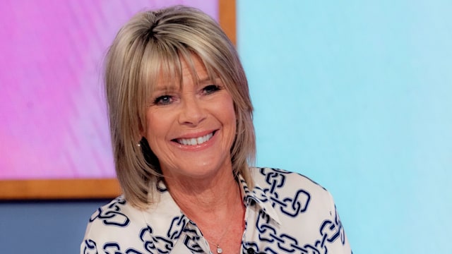 Ruth Langsford smiling in a chain print shirt on Loose Women